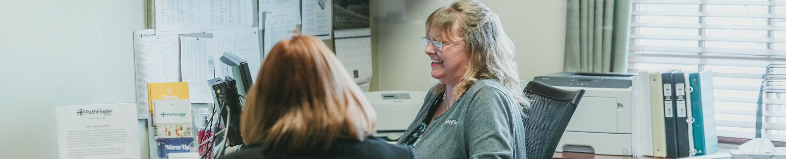 Employee at Bankinter S.A helping a customer in their office